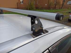 Багажник AMOS BETA на штат.места TOYOTA Avensis III kombi 5дв 2009-2018 (аэродинамич.дуги с замком)